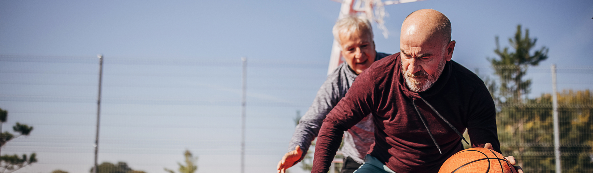 Two men playing basketball 