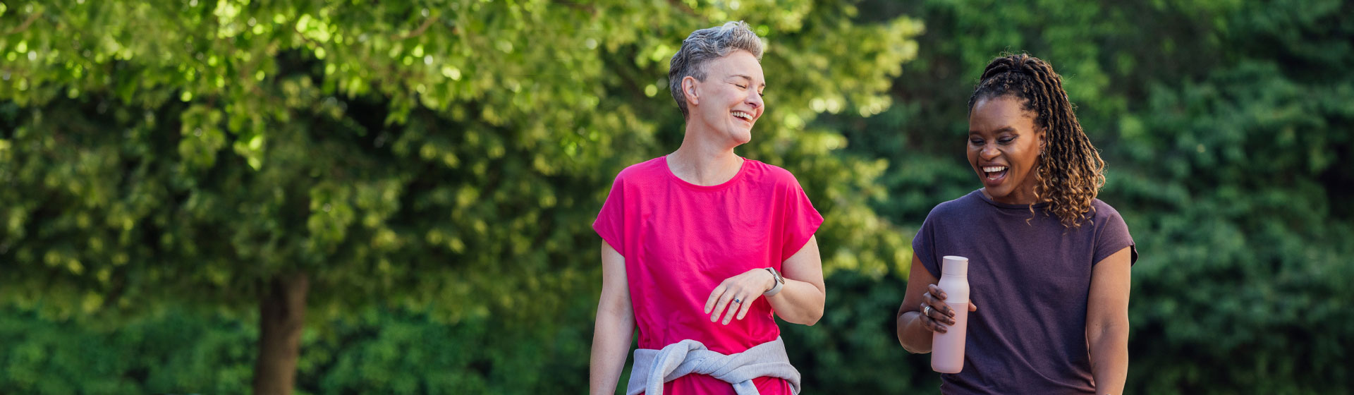 Two women walking in a park