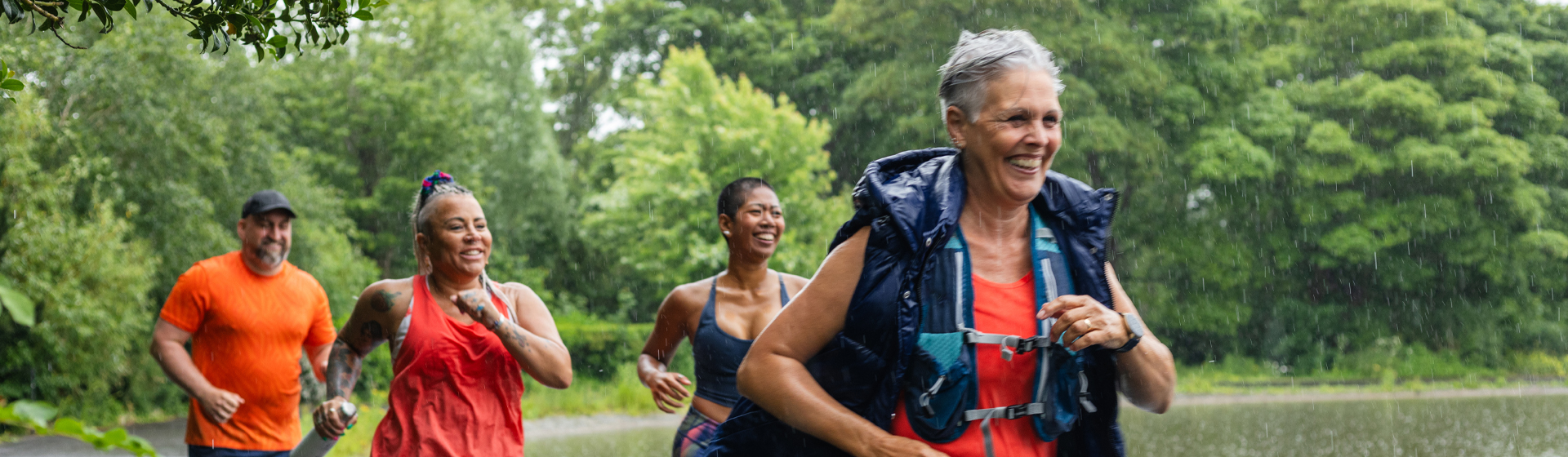 Women running in the rain
