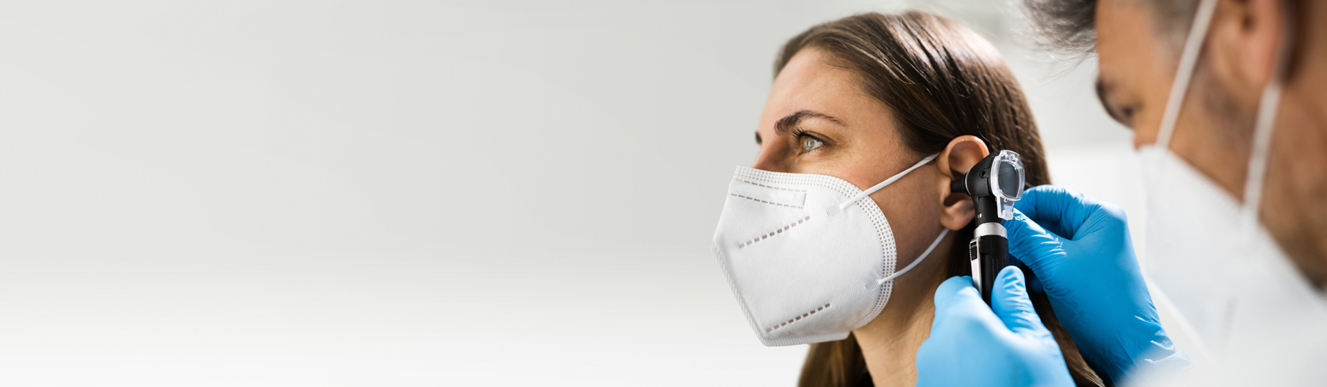 Woman getting her ear checked