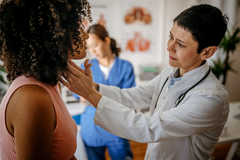 Primary care provider evaluates patient's lymph nodes