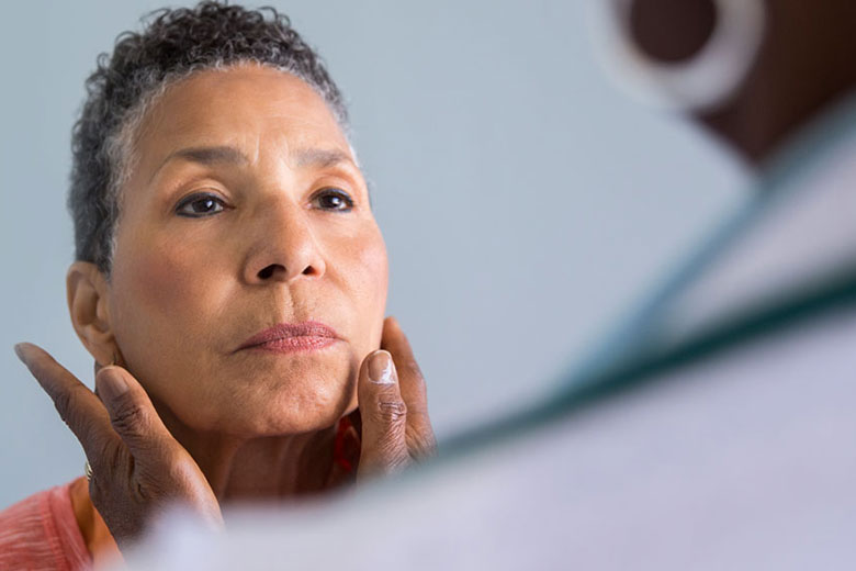African American woman examined by female doctor
