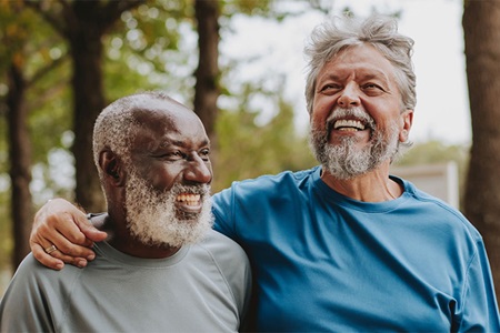 Two men smiling and walking together