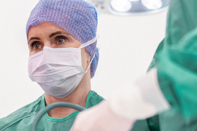 Medical staff preforming surgery